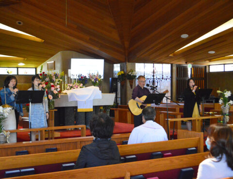 A small group attending a church service with live music.